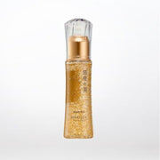 Hakuza Beauty Essence bottle showing elegant platinum gold leaf flakes suspended in clear serum