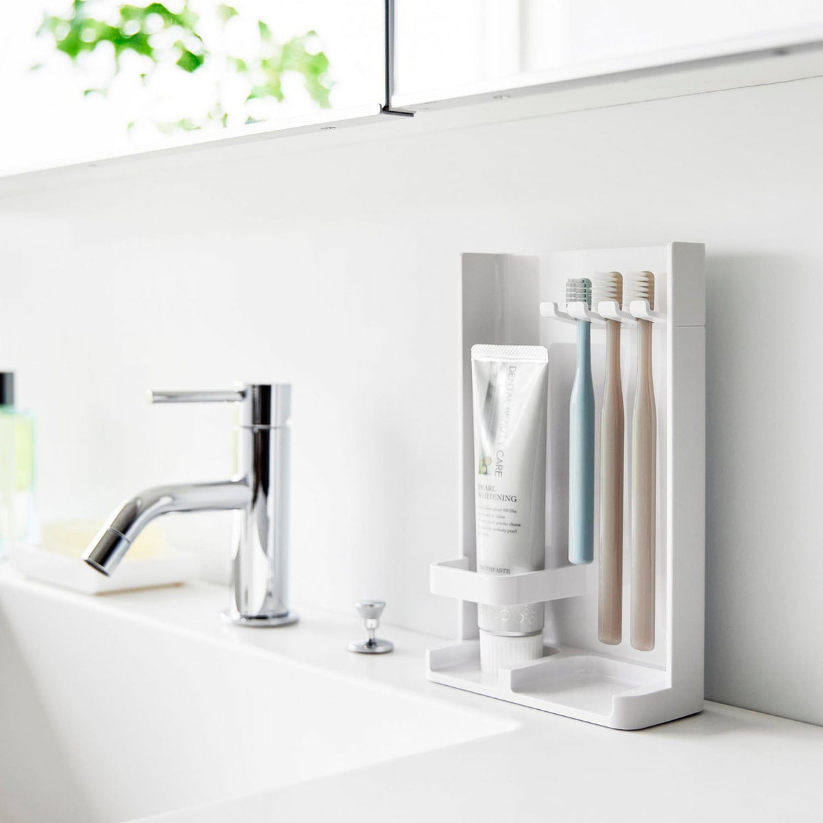Yamazaki Tower Slim Toothbrush and Tube Stand with Hide-Away Back, Slim Stand for Three Toothbrushes and One Tube that Hides the Brush Handles When You Flip It Around, 13.2 x 6.1 x 21.1 cm and 165 g, White or Black
