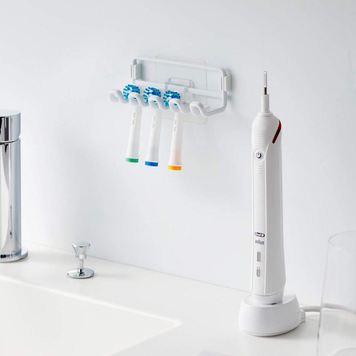 Yamazaki Tower Film-Hook Spare Brush Head Holder, Film-Hook Holder for Four Spare Electric Toothbrush Heads that Floats Them Apart to Dry, Sticks to Tile and Glossy Walls, 11 x 4.5 x 4 cm and 90 g, White or Black