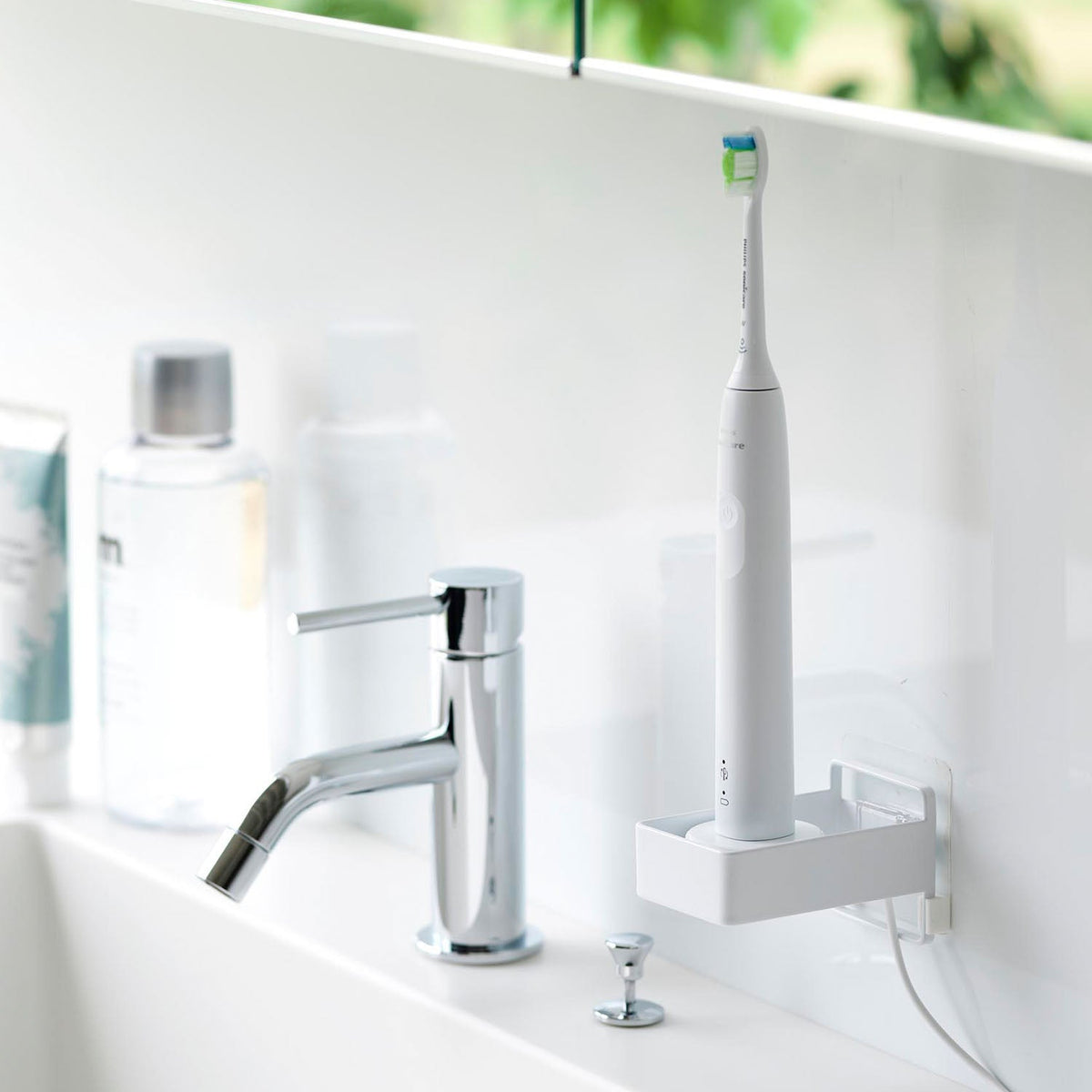 Yamazaki Tower Film-Hook Electric Toothbrush Charger Rack, Small Rack on a Film Hook That Floats an Electric Toothbrush With Its Charger on a Bathroom Wall, Slotted Base Drains Water, Cord Passes Through, 5.6 x 8.7 x 5.5 cm and 130 g, White or Black
