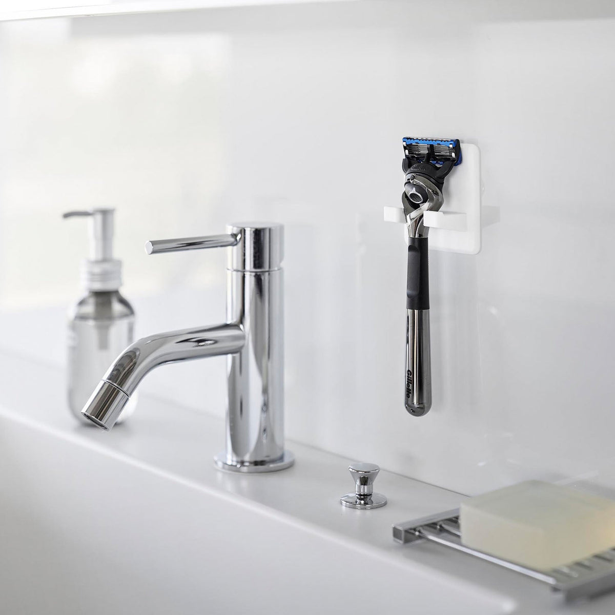 Yamazaki Tower Silicone Suction Shaver Holder, Silicone Suction Holder that Floats A shaver on a Glossy Wall so Water Drains Off, Peel It Off to Wash and Re-Stick, Heat Resistant to 250 C, 6 x 2.5 x 6 cm and 20 g, White or Black
