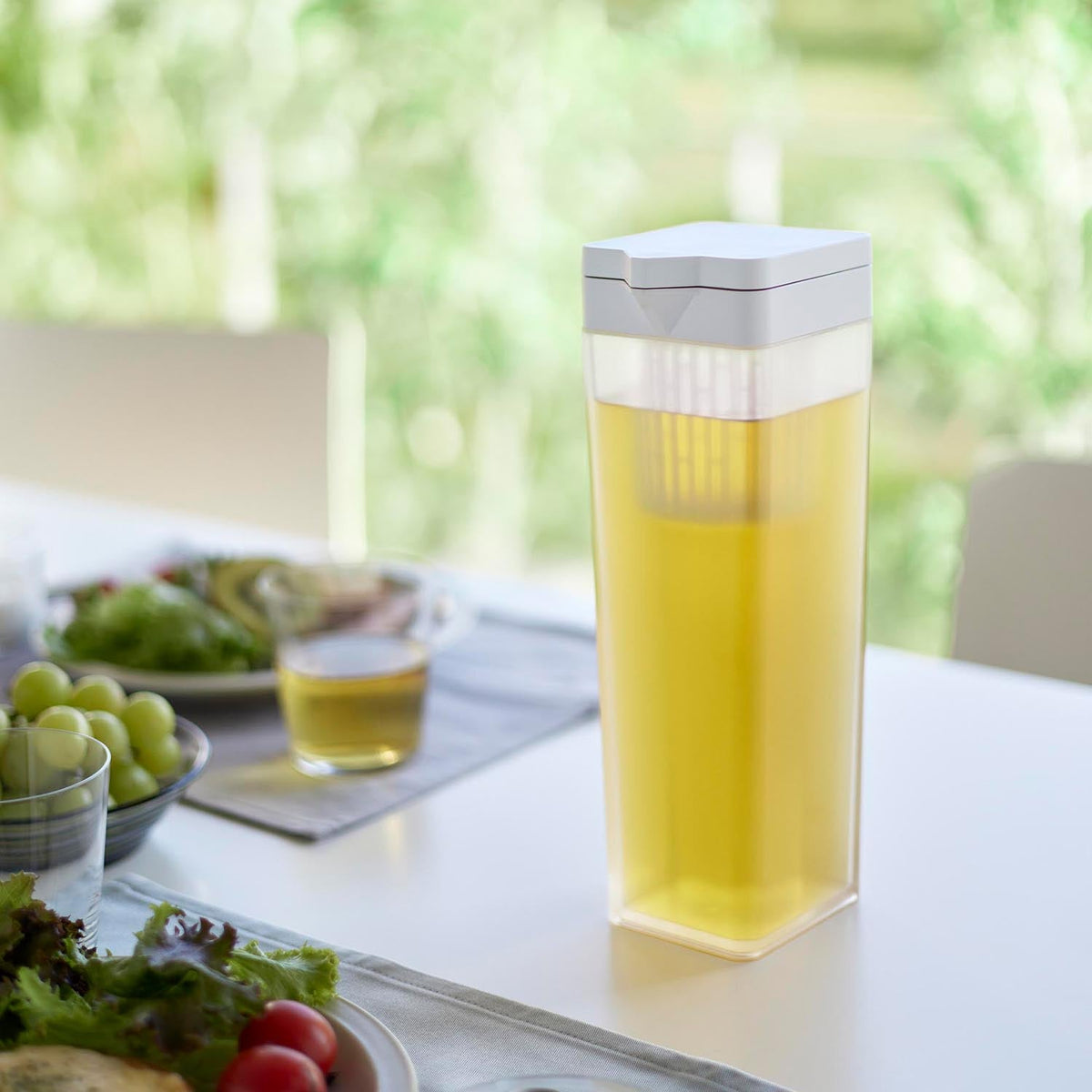 Yamazaki Tower Tilting Cold Water Pitcher 1.2 L with Tea Bag Holder, Slim 1.2 L Cold Pitcher That Lies Flat in the Fridge Without Leaking, Fits the Door Pocket, Tea Bag Holder, 8.5 x 10 x 27.2 cm and 515 g, White or Black