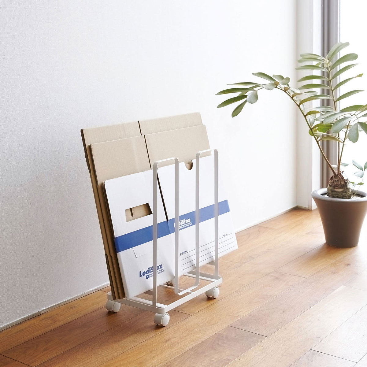 Yamazaki Tower Cardboard Stocker, Slim Rack on Casters That Stores 10 to 15 Flattened Cardboard Boxes and Lets You Pass String Under to Tie Them In Place, 30 cm Wide, Holds 5 kg, 30 x 23 x 43.5 cm and 1200 g, White or Black