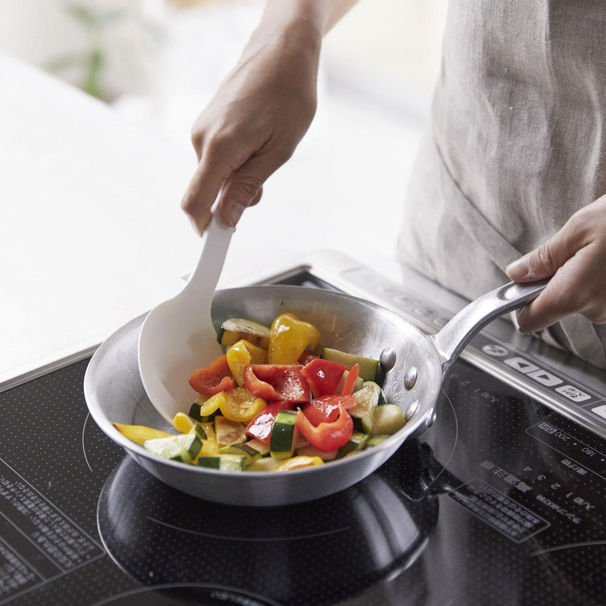 Yamazaki Tower Silicone Cooking Spoon, Deep Cooking Spoon That Handles Stir-Frying Through Serving and Is Gentle on Pots and Frying Pans, Tip Lifts Off the Counter, Silicone Over a Nylon Core Heat Safe to 220 C, 7 x 3 x 26 cm and 52 g, White or Black