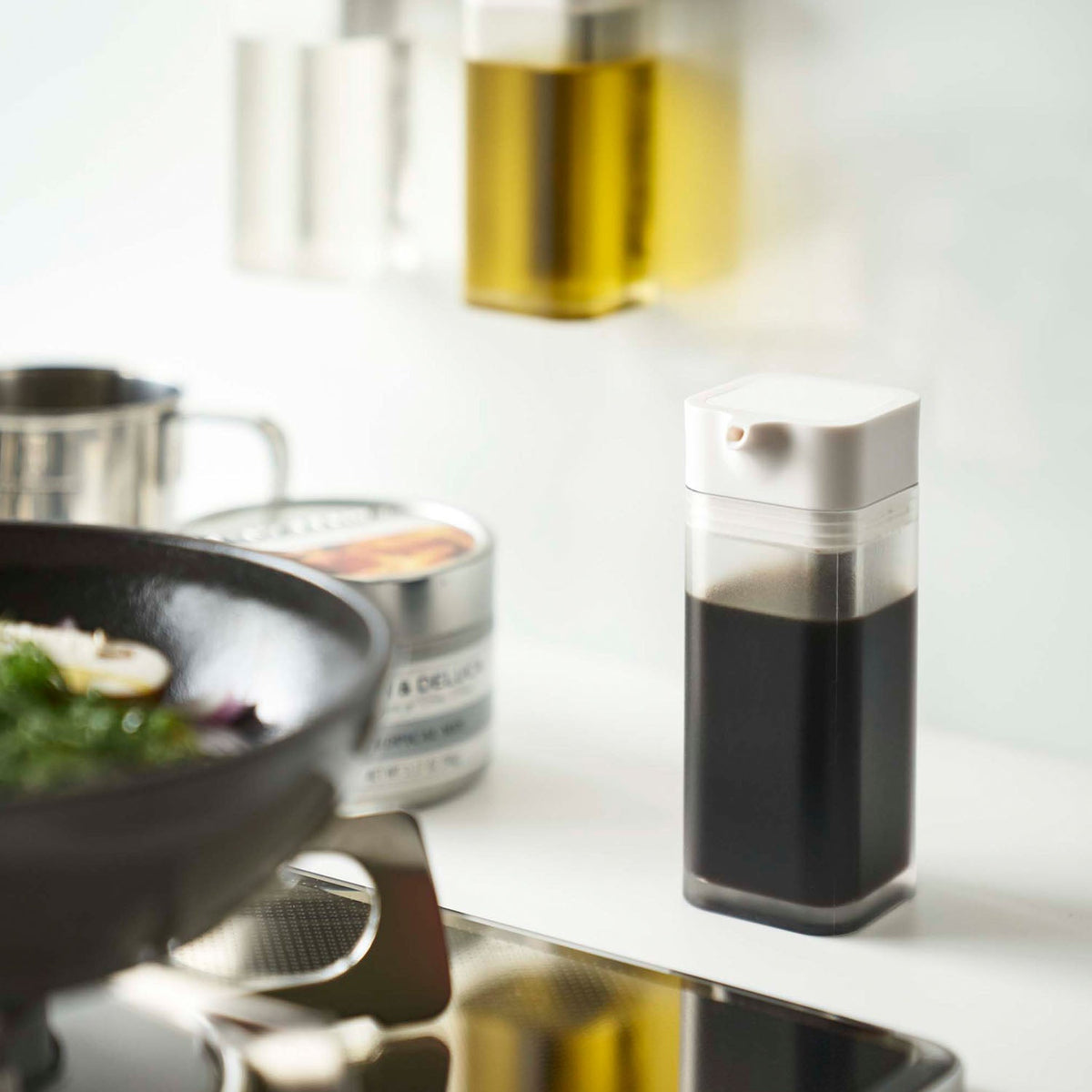 Yamazaki Tower Magnetic Push Soy Sauce Bottle, 90 mL Soy Sauce Bottle With a Push Button You Press to Pour in Small Amounts, Sticks to a Steel Kitchen Panel by Magnet, Comes Apart to Clean, 4.2 x 5.5 x 10.5 cm and 85 g, White or Black