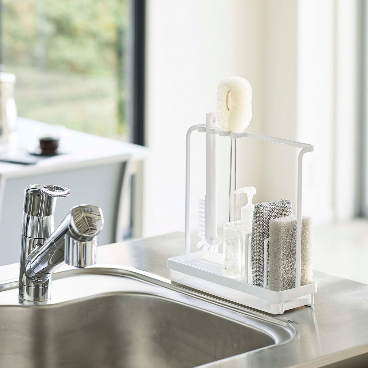 Yamazaki Tower Sponge and Cleaning Tool Stand, Stand That Drains Two Sponges and Hangs a Flask and Sink Brush Over a Water Tray Beside the Sink, Needs a Flat Spot 25 cm Wide, Heat Safe to 120 C, 25 x 9 x 24.5 cm and 660 g, White or Black