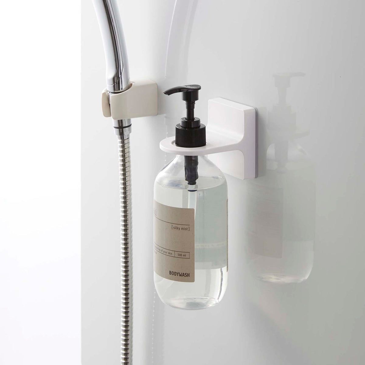 Yamazaki Tower Film-Hook Dispenser Holder, Holder on a Film Hook That Floats a Pump Dispenser on a Bathroom Tile Wall and Lets You Press the Pump on the Wall, Adapter Rings Included, Holds 1 kg, 6.3 x 9 x 7 cm and 55 g, White or Black