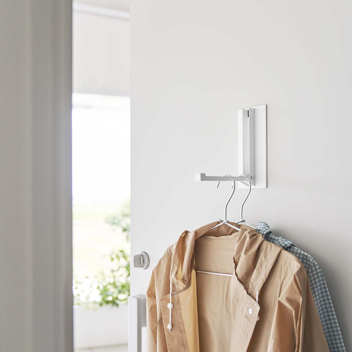 Yamazaki Tower Magnetic Folding Hanger, Magnetic Folding Arm for a Steel Door or Fridge that Holds a Wet Coat or Apron, Folds Flat, In use 8 x 16.5 x 18 cm; folded 8 x 3 x 18 cm and 340 g, White or Black