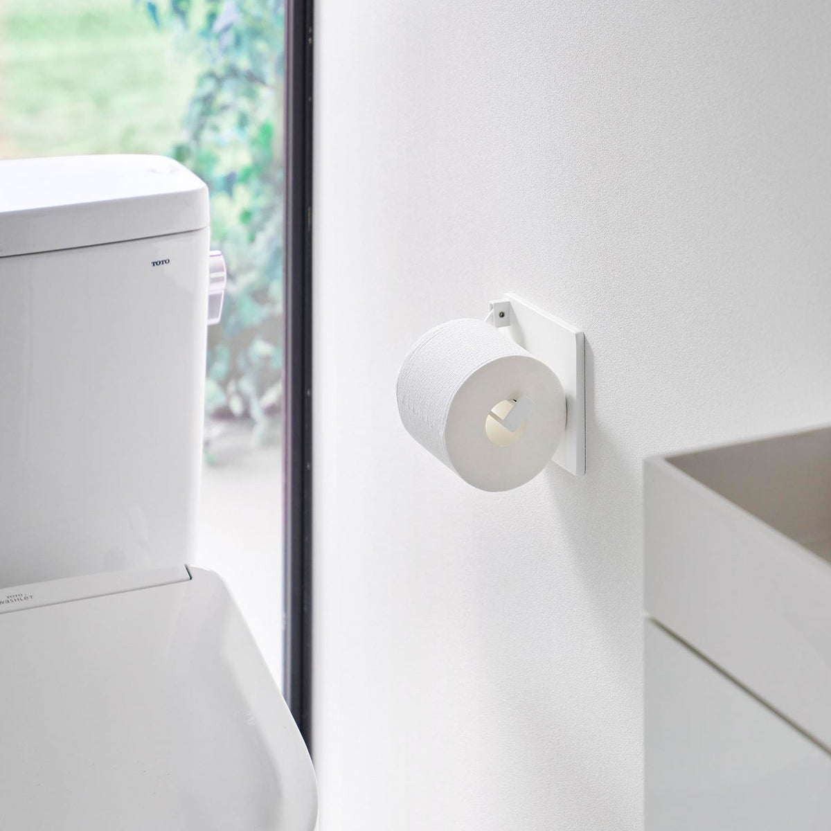 Yamazaki Tower Wall Toilet Paper Holder for One-Hand Cutting, Wall-Mounted Steel Holder with a Weight that Lets You Cut Toilet Paper with One Hand, with Plasterboard Pins and Screws, 14.5 x 2.4 x 12 cm and 340 g, White or Black