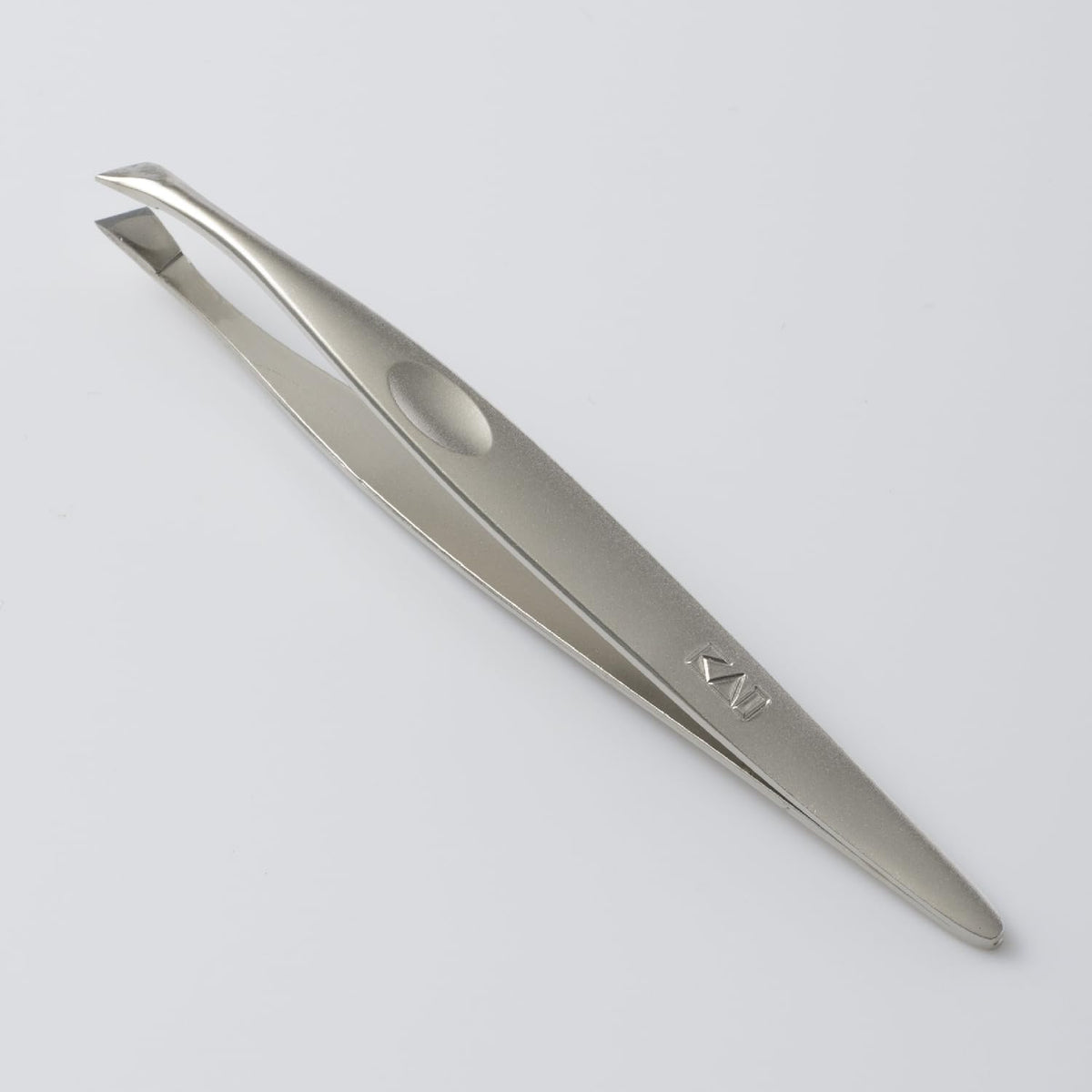 KAI Groom! Slant-Tip Tweezers HC3043, Nickel-Plated Iron Tweezers with Dimple Grip for Fine Hair and Brows, Silver, Made in Japan