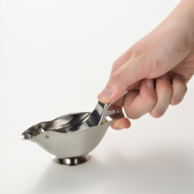 Polished stainless steel bird-shaped lemon juicer by Akagawa Kinzoku