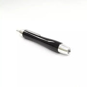 Delight Labo Elegant Piano Black Ballpoint Pen featuring a high-gloss lacquer finish and gold accents on a professional desk setting