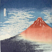 A square Red Fuji Ukiyo-e cotton Furoshiki cloth featuring a vibrant red Mount Fuji and white clouds on a blue background.