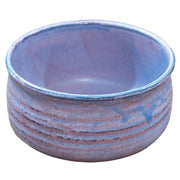 Handcrafted pink Hasami porcelain matcha bowl sitting next to its traditional wooden gift box on a clean surface