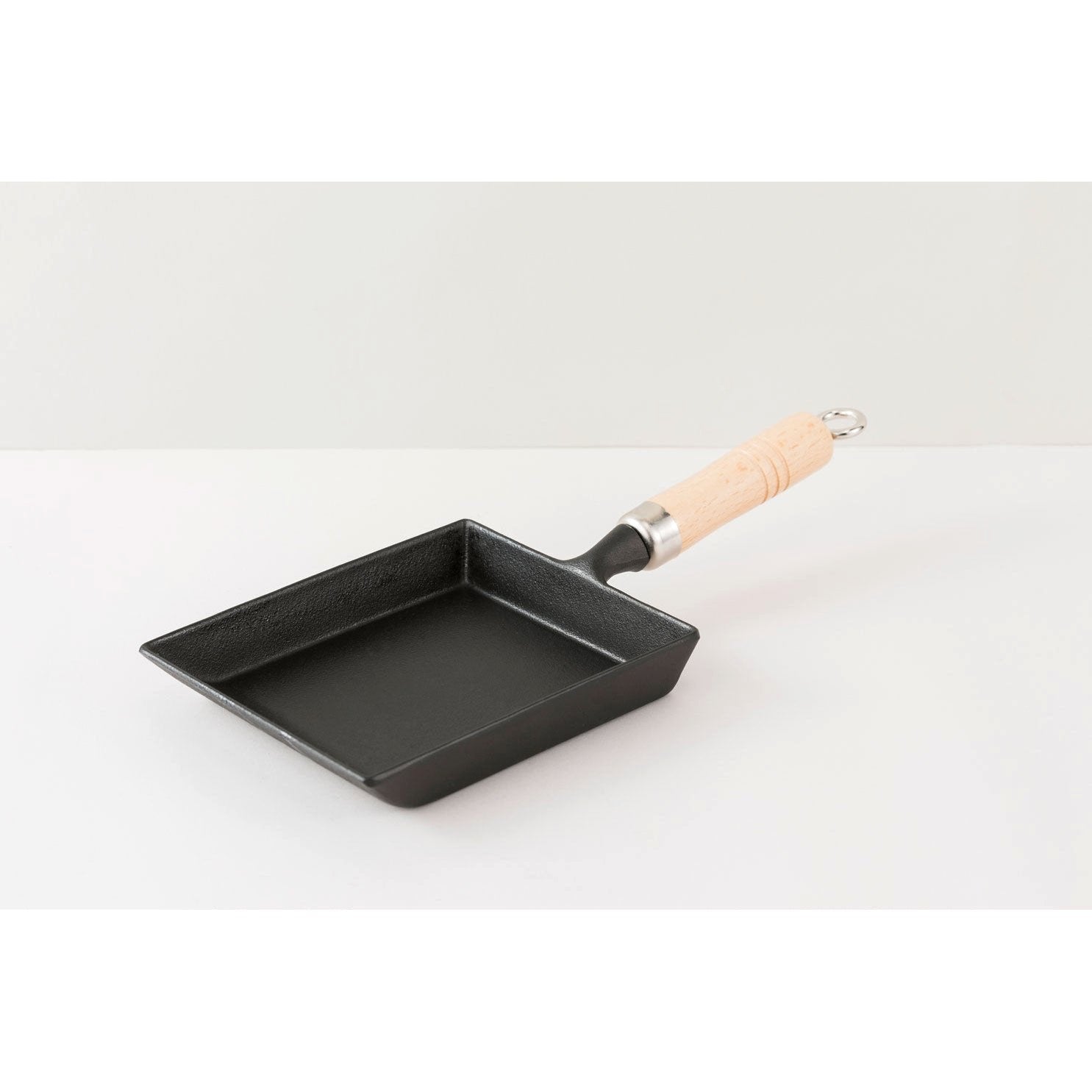 Iwachu 18cm Nambu Cast Iron Tamagoyaki Pan with integrated handle on a white background