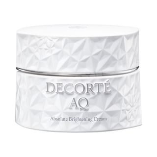 Kose DECORTE AQ Absolute Brightening Cream jar and product texture swatch, showcasing its luxurious appearance and creamy consistency.