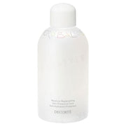 Kose DECORTE Microbalm Lotion bottle on a reflective surface, showcasing its luxurious packaging and texture.
