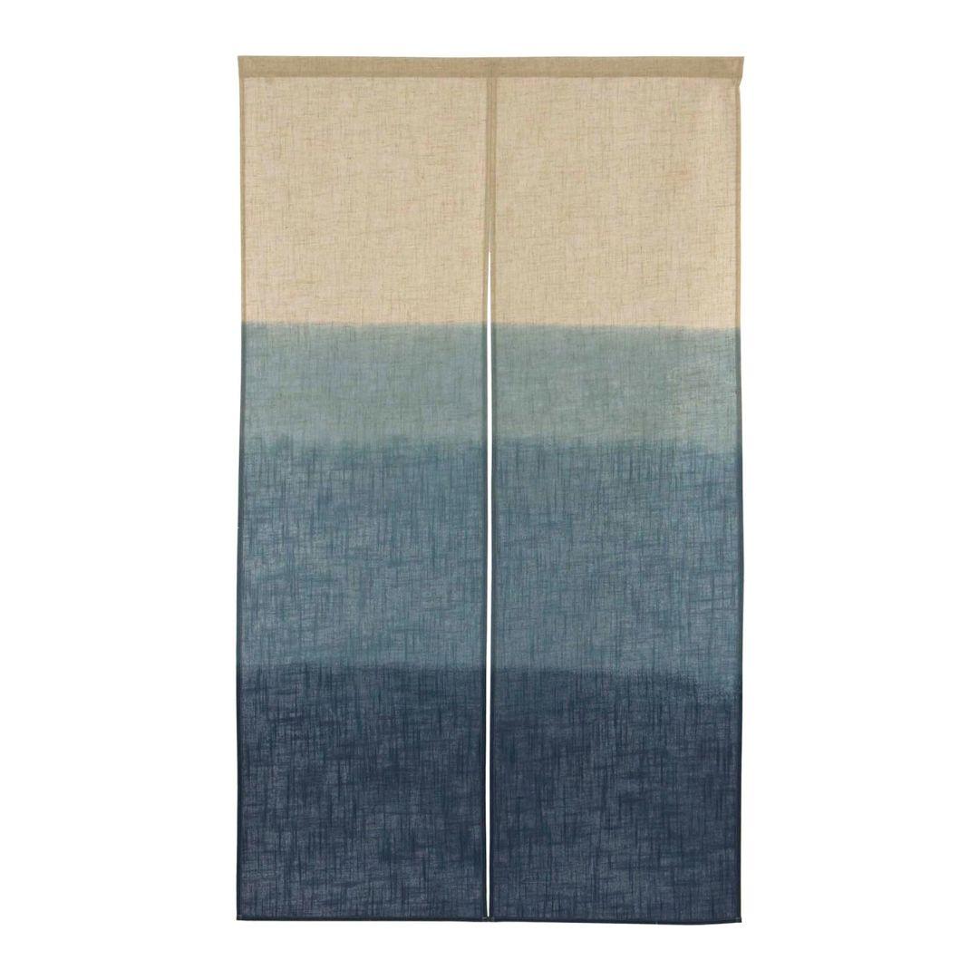 Hand-printed blue indigo Japanese noren curtain made of natural linen hanging in a doorway