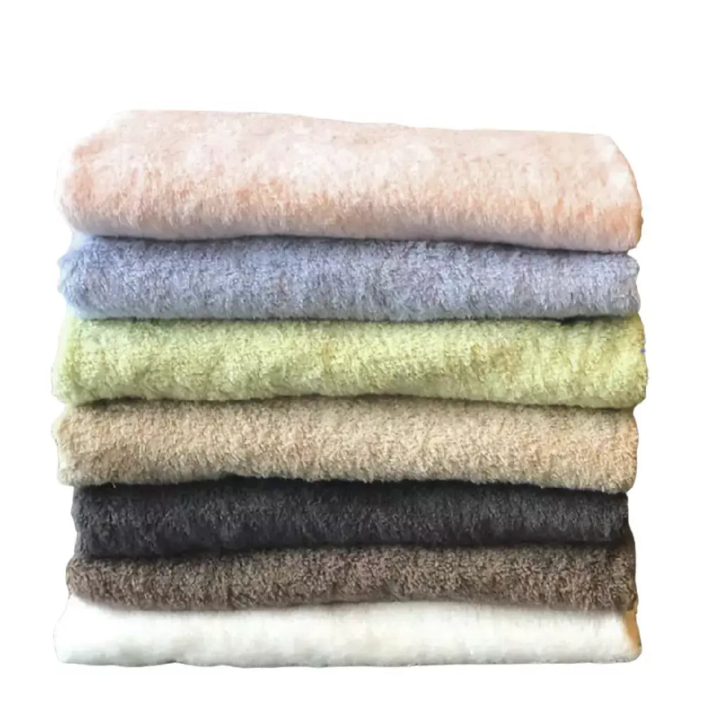 Onaru Premium Imabari Cotton Bath Towel in white, folded neatly to show the plush texture and 68x125cm dimensions