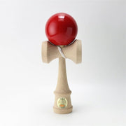 Official Ozora Red Kendama with JKA certification sticker on a wooden handle and red painted ball