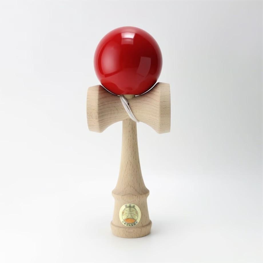 Official Ozora Red Kendama with JKA certification sticker on a wooden handle and red painted ball