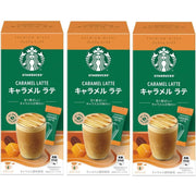 Starbucks Caramel Latte Premium Instant Mix box with 3 sachets shown next to a frothy latte cup