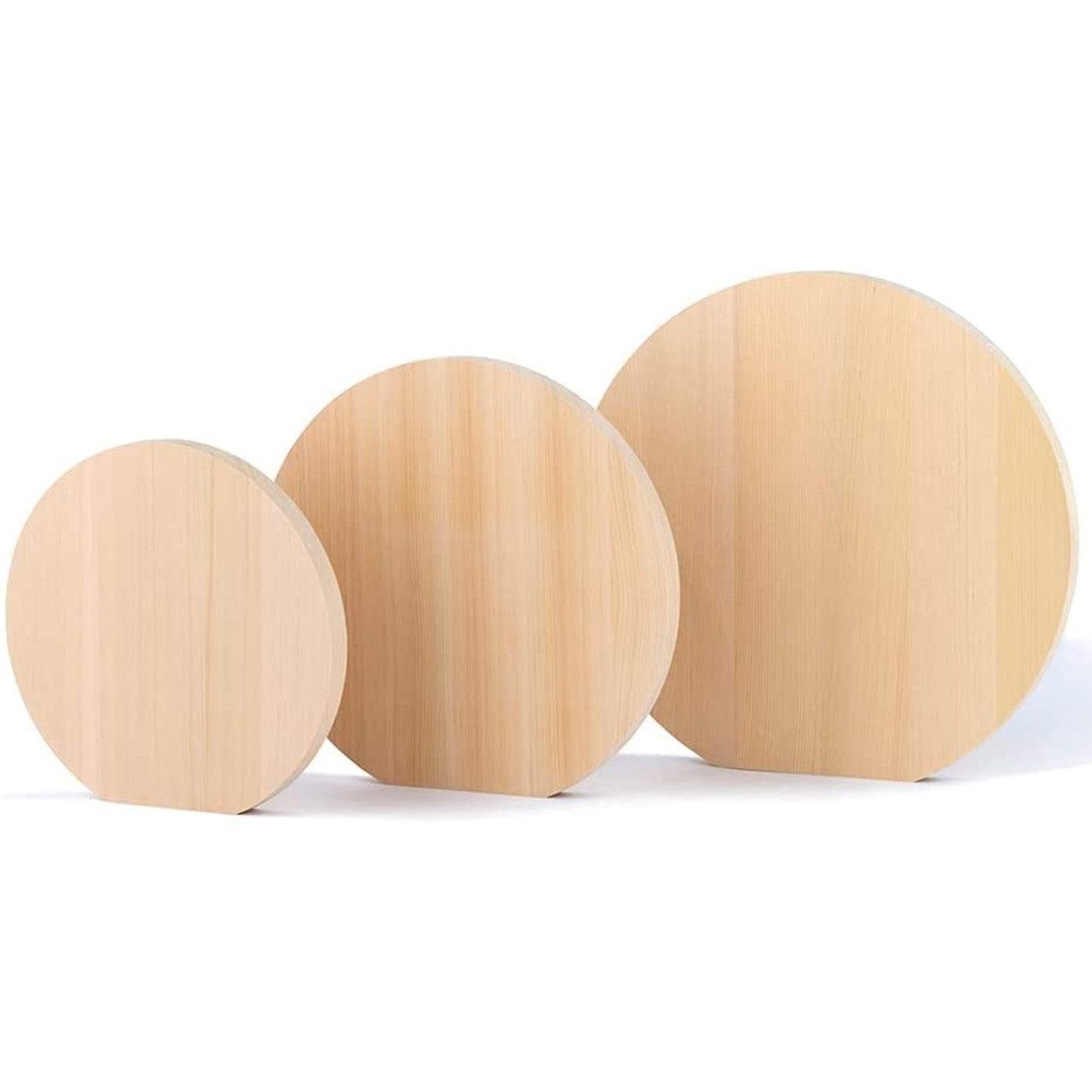 Umezawa premium round cutting board made of light-colored Aomori Hiba wood showing natural grain