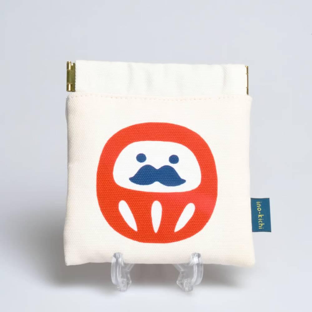 Handcrafted white Shirakawa cotton drawstring pouch featuring a red traditional Daruma amulet charm.
