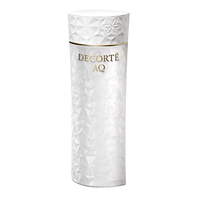 Kose DECORTE AQ Toning Lotion A bottle displayed on a reflective surface, highlighting its elegant packaging and the light texture of the product.