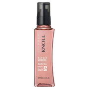 Kose Stephen Knoll Repair & Control Hair Oil W bottle showcasing the product's texture and label.