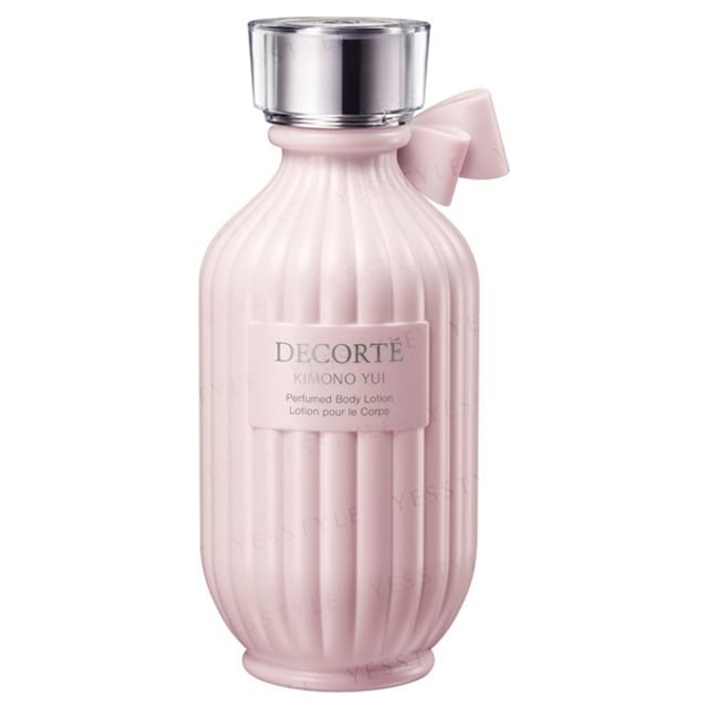 Kose DECORTE Kimono Yui Perfumed Body Lotion bottle on a silk background with cherry blossom accents.