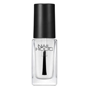 Kose Nail Holic Quick Dry Oil bottle with freshly painted nails, showcasing a glossy, smudge-free finish.
