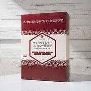 Close-up of a steaming cup of Rokkado Spicy Ginger Tea, highlighting the rich color and inviting aroma.