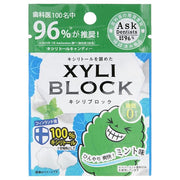 Okuchi XYLI Block Cavity Preventing Xylitol Mint package and individual mints displayed, emphasizing the refreshing mint flavor and benefits of xylitol for oral health.