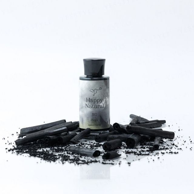 Happy Natural Bio Activated Hemp Charcoal Powder in a glass jar with a scoop, showcasing its dark color and texture.