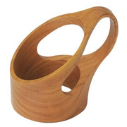 Hand-carved Japanese cherry wood cup holder showcasing natural wood grain and artisan craftsmanship