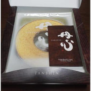 A single slice of Yanagawa Gluten-Free Milk Jam Rice Flour Baumkuchen showing delicate golden layers