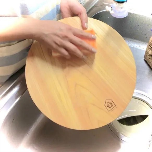Cipresso K hinoki cutting board in prep use — round design allows rotation for fresh surface