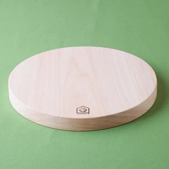 Cipresso K hinoki round board — side profile showing 32mm thickness, no coating
