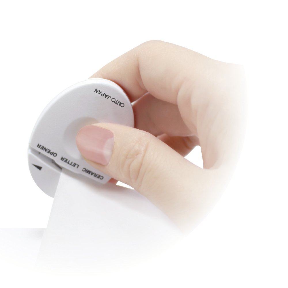 OHTO white ceramic letter opener — hand-held use